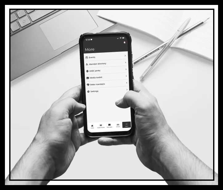 hands holding mobile phone showing screen of Media Toolkit option under More...